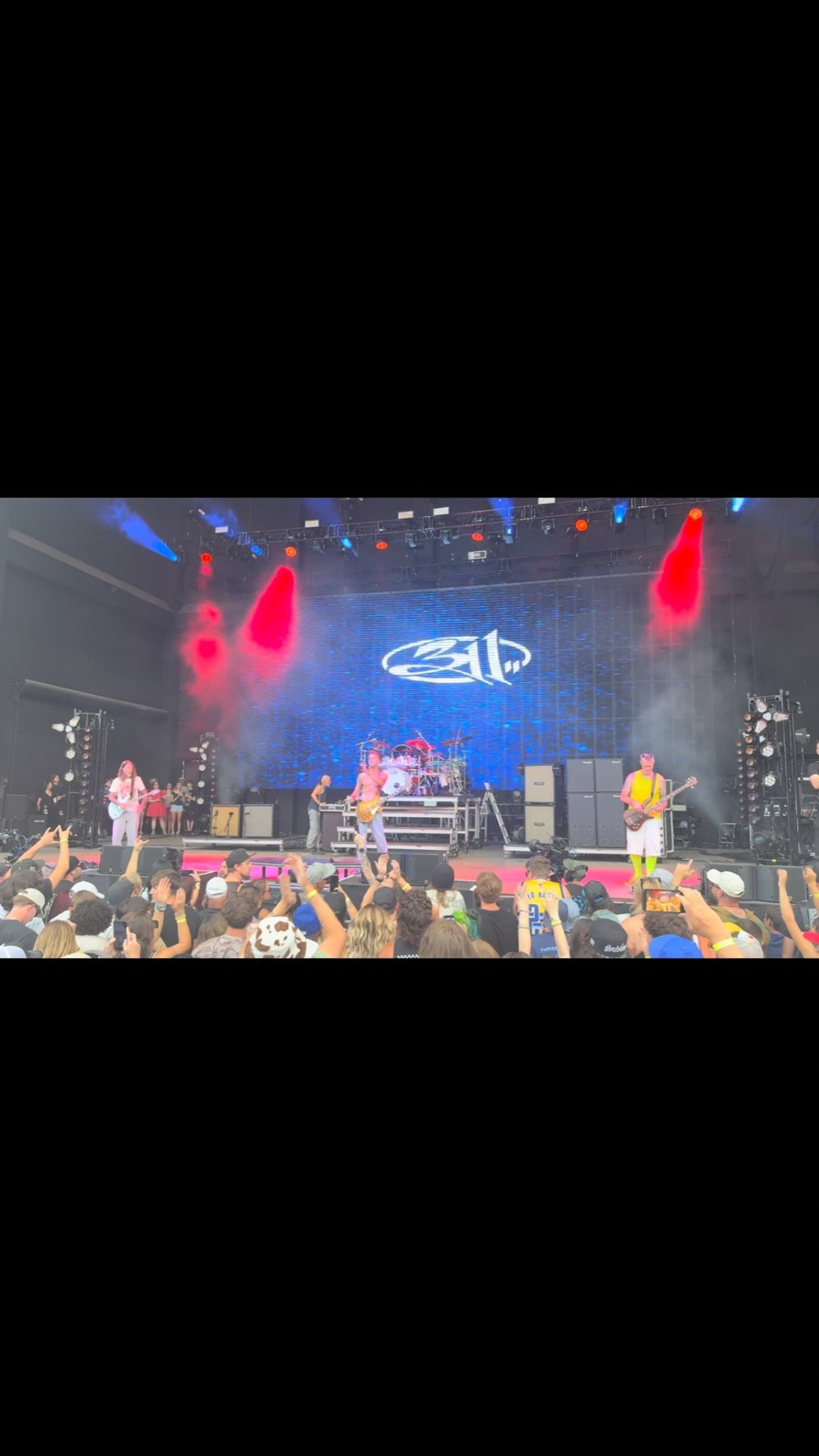 A concert stage lit in vivid color